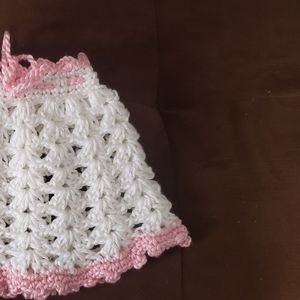 Handmade knitted baby girls clothes